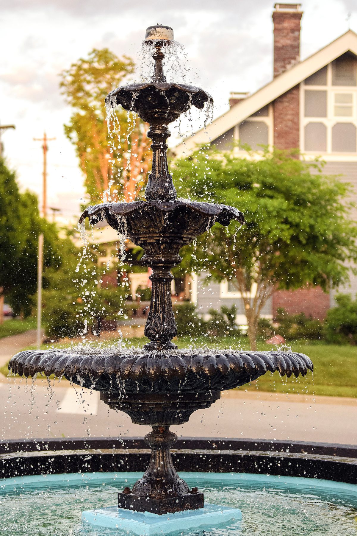 Vertical Closeup Of An Ancient Outdoor Fountain In A Garden